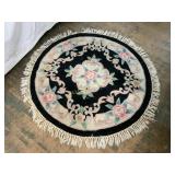 Round Wool Rug with Floral Motif and Fringe