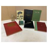 Books and Embossed Glass Bottle