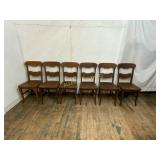 Six Wooden Ladder Back Chairs