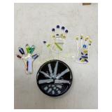 Glass Art Pieces in Hand and Circular Designs