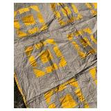 Patchwork Quilt with Yellow and Gray Design