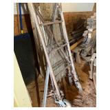 Metal scaffolding and two walkboards with wheels