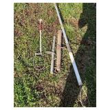 Two metal animal catchers and tack