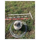 Two metal levels, measuring straight edge and coil