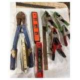 Assorted Hand Tools Including Levels and Clamps