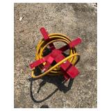 Metal Hose Reel With Attached Yellow Hose