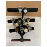 9 Wristwatches on Display Stand