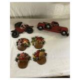4 Decorative Metal Wall Plaques and 2 Toy Trucks