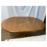 Oval Pedestal Dining Table in Oak Finish