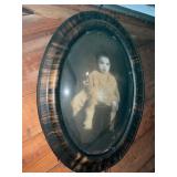 Oval Framed Sepia-Tone Photograph of a Child