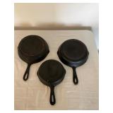 Three Cast Iron Skillets with Assorted Sizes