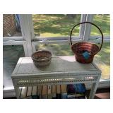 White Wicker Console Table with Books and Baskets