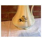 Cream-Colored Ceramic Pitcher with Floral Motif