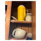 Kitchen Cabinet with Plastic and Ceramic Tableware