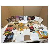 Collection of Vinyl 45 RPM Records and Sleeves