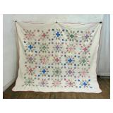 Hand-Crafted Quilt with Floral Motif