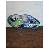 Metal Sign Shaped Like a Racecar