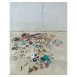 Costume Jewelry Lot with Necklaces, Rings, and Bra