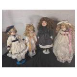 Four Porcelain Dolls With Elaborate Costumes