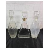 Three Faceted Glass Decanters