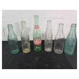 Six Vintage Glass Soda Bottles