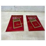 Pair of Falcon Tin Signs