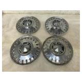 Four Dodge Dart Hubcaps