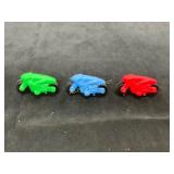 Three Plastic Toy Motorcycles