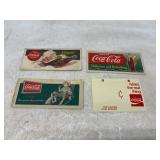 Four Coca-Cola Advertising Signs