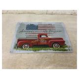 Metal Sign with Red Truck and American Flag Design