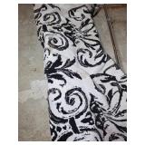 8ï¿½10 Area Rug with Black and White Scroll Pattern