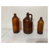 Three Amber Glass Bottles