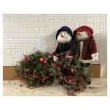 Two Snowman Figures with Christmas Wreaths