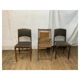 Three Wooden Chairs One is Folding