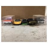 Five Die-Cast Model Cars in Display Cases