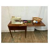 Singer Sewing Machine in Wood Cabinet
