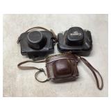 Three Vintage Cameras with Cases