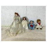 Four Porcelain Dolls in Wedding and Sailor Attire