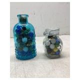 Two Glass Jars With Assorted Marbles