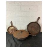 Three Cast Iron Skillets With Lid