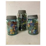 Three Glass Jars Filled withï¿½ Marbles