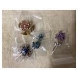 Four Floral Themed Rhinestone Jewelry Pieces