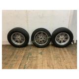 Three Automotive Wheels and Tires