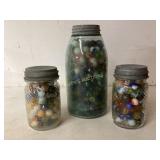 Three Glass Jars (2 Are Jumbo Peanut Jars) Contain