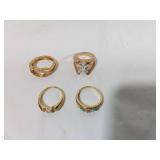 Four Gold-Tone Rings with Stones