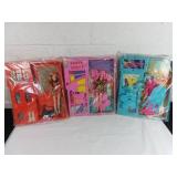 Three Dolls With Themed Scenes in Display Cases