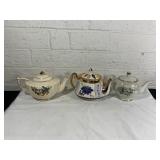 Three Ceramic Teapots with Floral Motifs