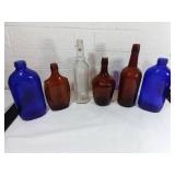 Six Glass Bottles in Varied Colors