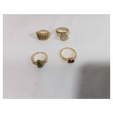 Four Assorted Gold Rings with Gemstone Accents