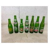 7 Green Glass Soda Bottles